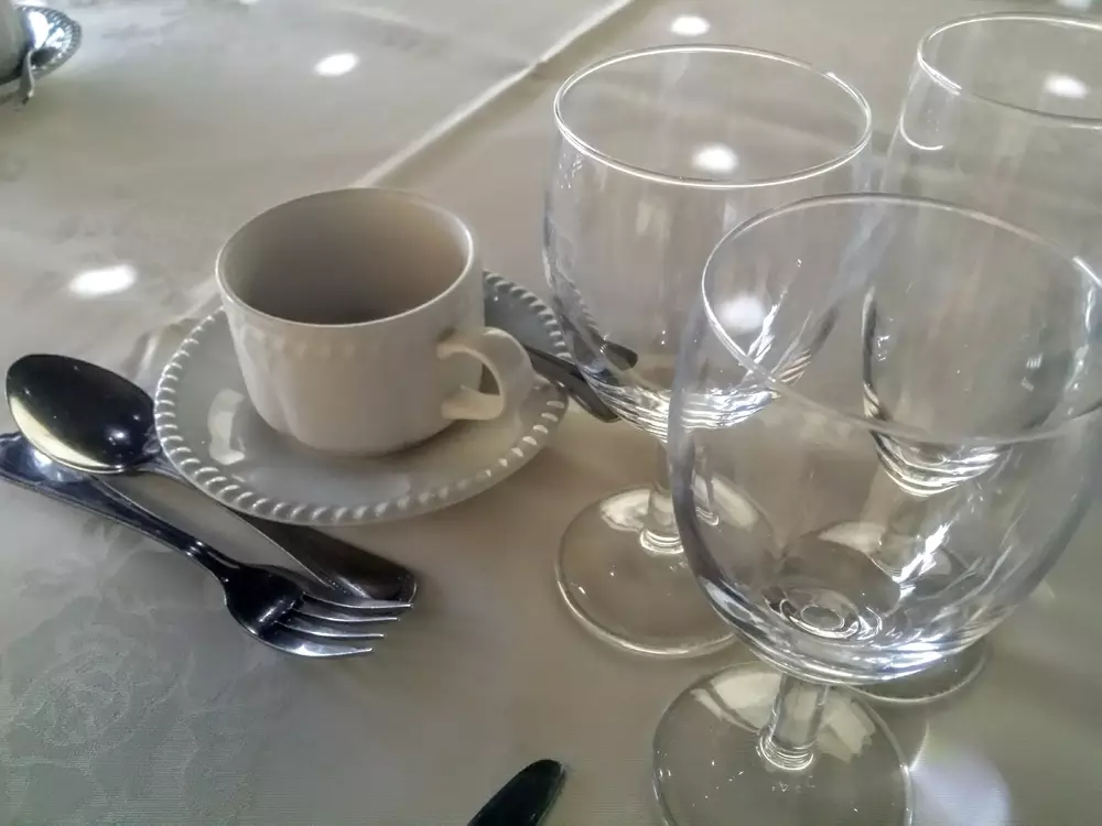 why should you hold glasses by the stem and cutlery from the middle